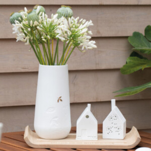 Räder Lichthäuser und Vase
